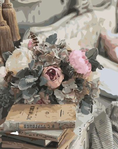 Bouquet of flowers on books with a decorative background and vintage theme