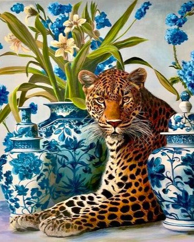 Leopard sitting among blue and white floral vases
