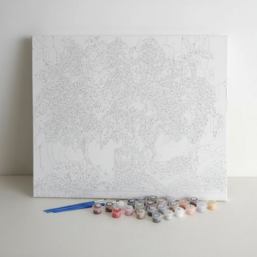 Pre-printed number stretch framed canvas on a stretch frame with paint pots and brushes