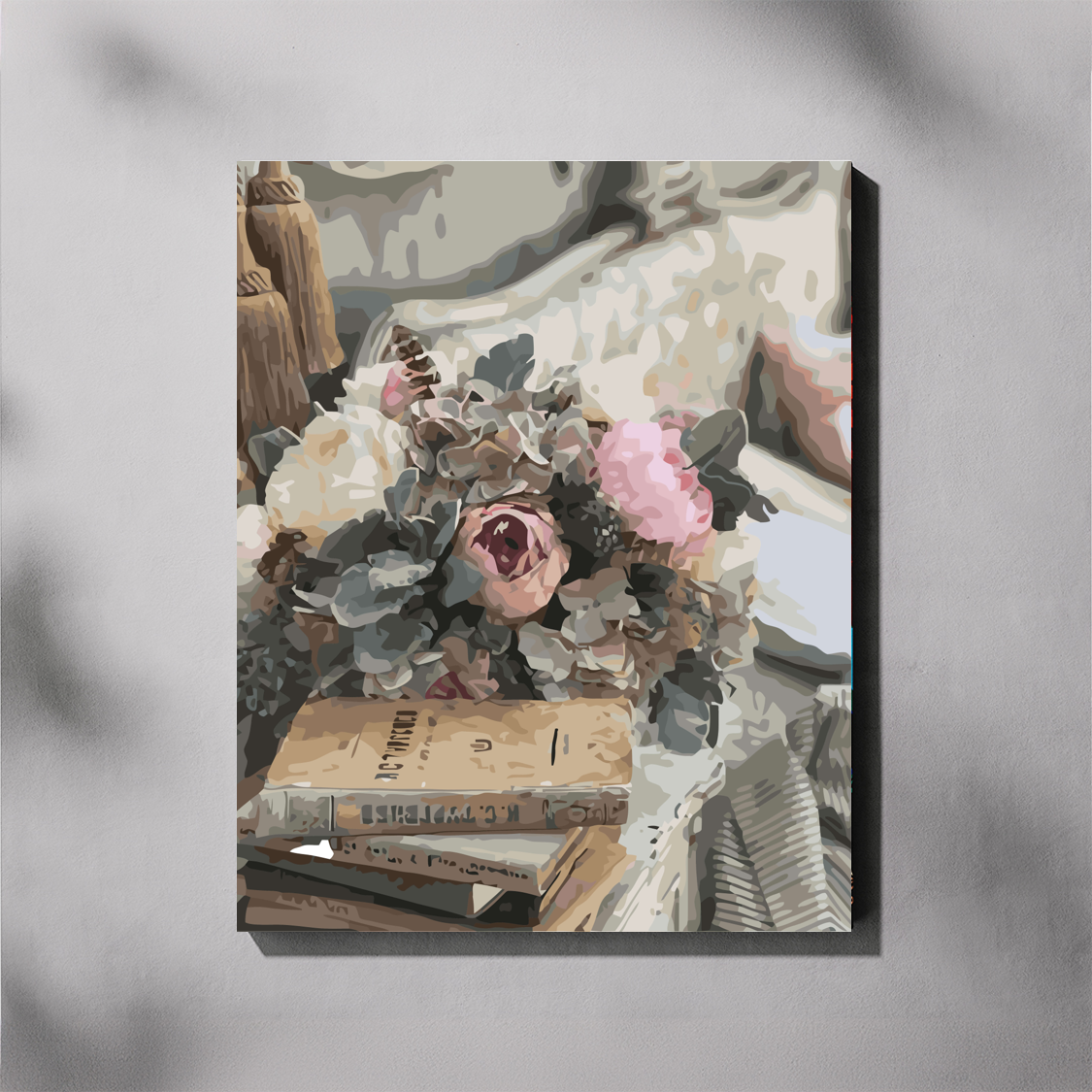 Canvas print of a floral arrangement on books with a gray background