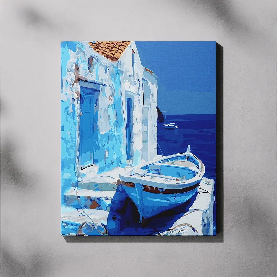 Canvas print of a blue boat against a white building with blue doors and windows, set against a clear blue sky.