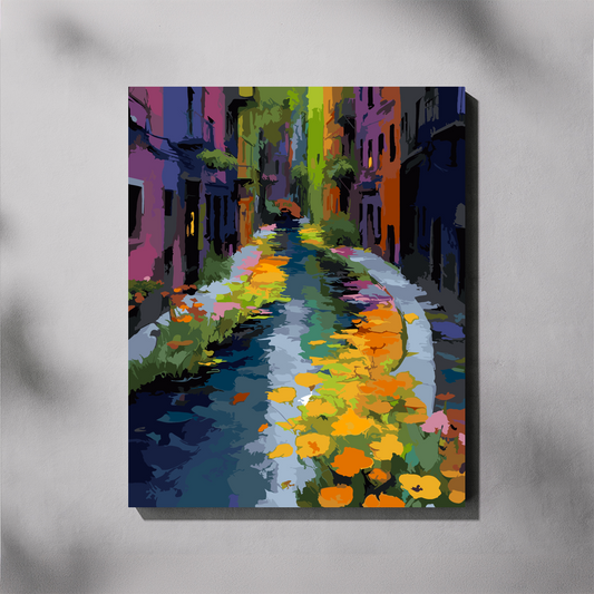 A vertical paint by number canvas of a colorful, impressionistic street scene with vibrant buildings and flowers, displayed on a light gray wall with soft shadows.