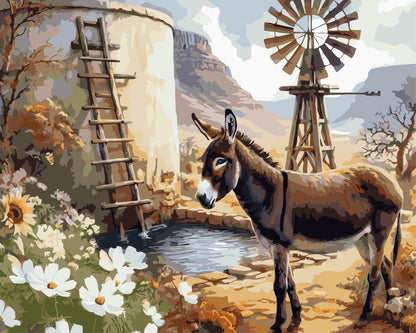 Paint by number of a donkey near a water tank and windmill with mountains in the background.