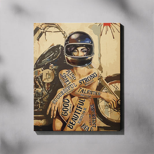 Canvas print of a woman in a helmet with motivational phrases on a motorcycle against a gray background