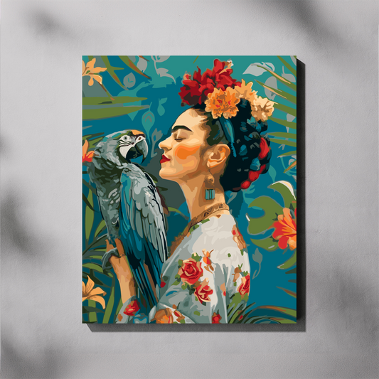 A vertical paint by number canvas featuring a stylized portrait of Frida Kahlo with a blue parrot, displayed on a light gray wall with soft shadow overlays.