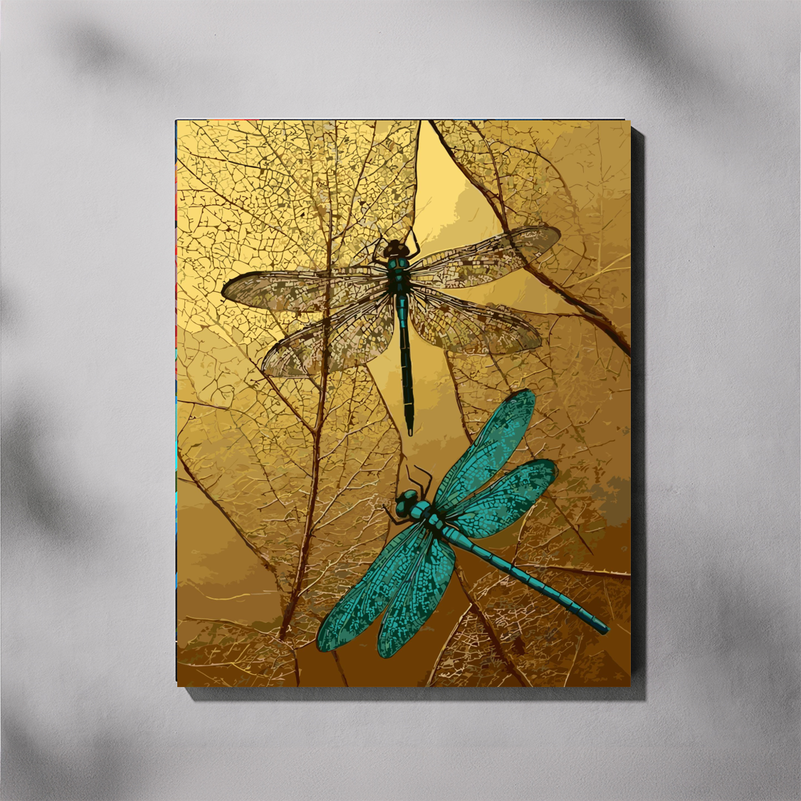 Gilded Dragonflies paint by number kit — completed canvas mockup of two dragonflies on skeletal gold leaves against a warm textured gold background
