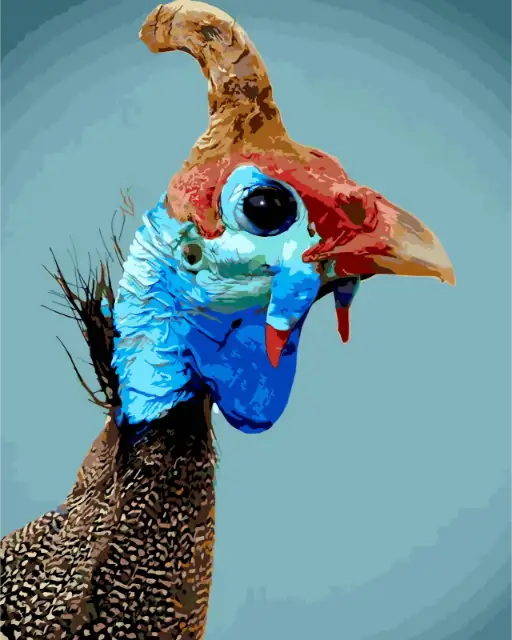 Close-up of a colorful bird with a blue face and red crest on a light blue background