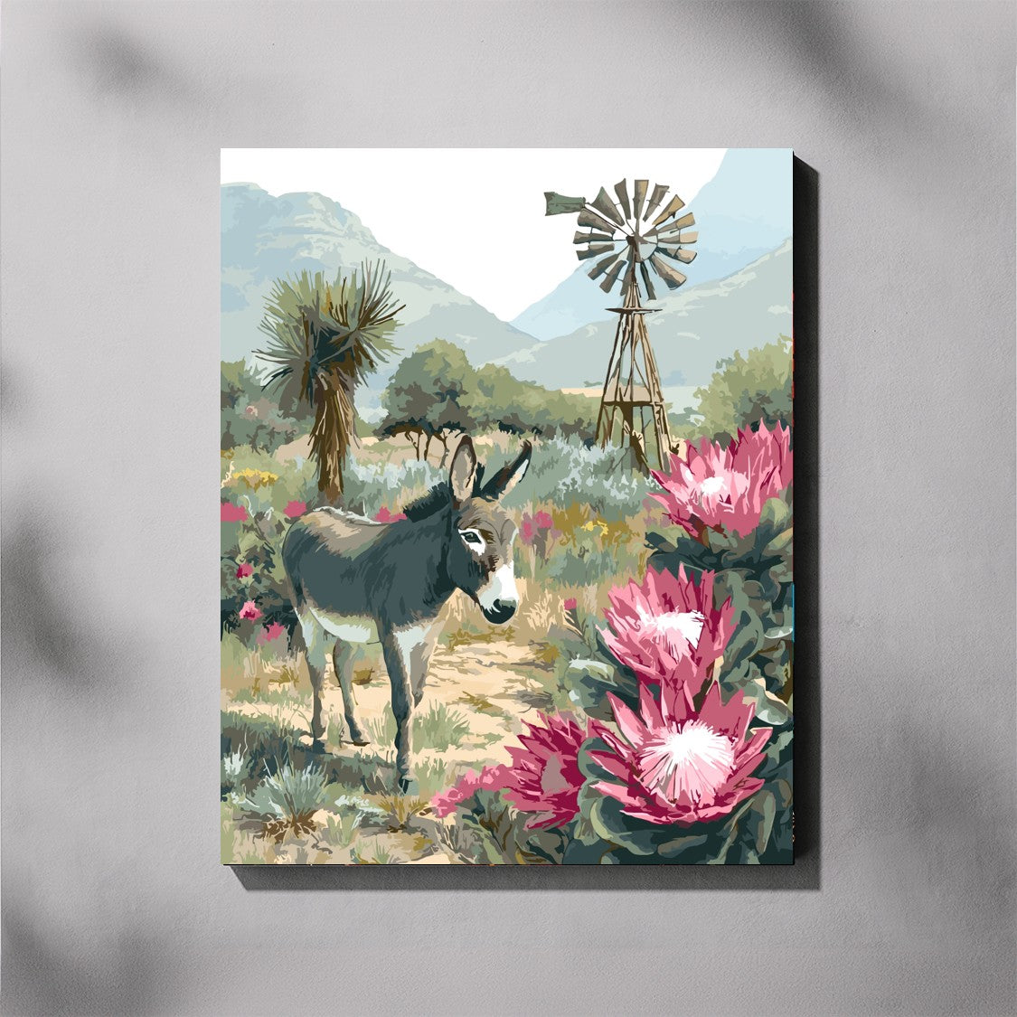 Canvas print of a donkey and pink flowers with a windmill in the background on a gray background
