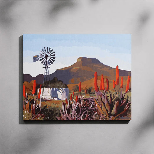 Canvas print of a landscape with a windmill and mountains on a gray background