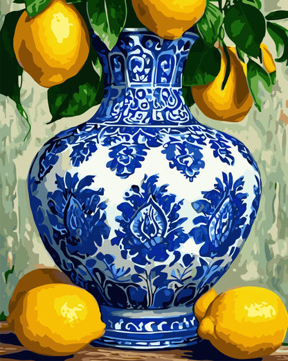 Blue and white floral-patterned vase with lemons and green leaves on a textured background