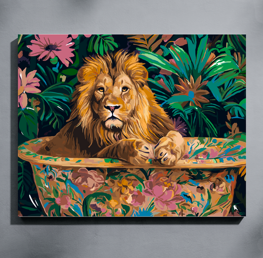 A colorful paint by number canvas wall art print showing a lion resting in a floral bathtub surrounded by tropical leaves, mounted against a gray wall.