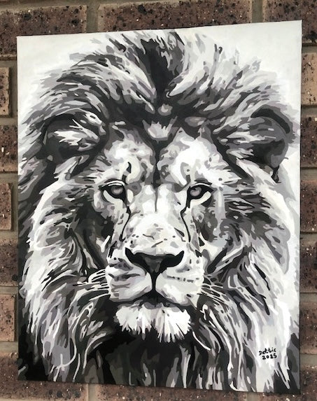 Black and white lion painting on a textured wall