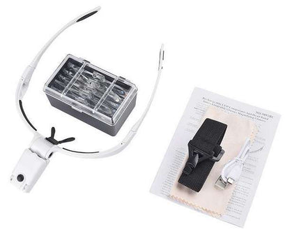 White headband with black clips on a white background