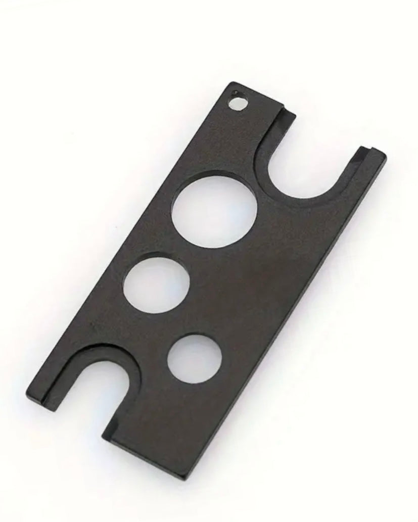 Black metal bracket with multiple holes on a white background