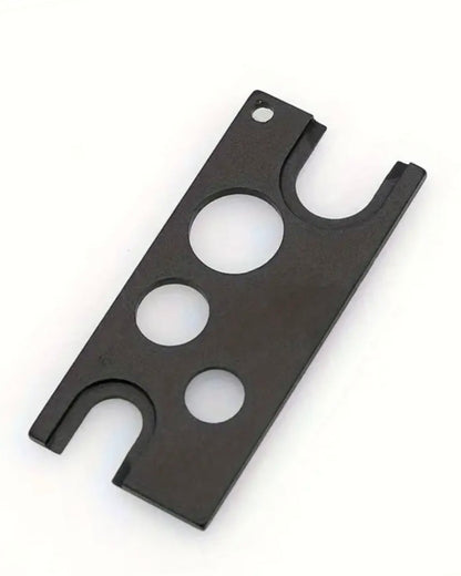 Black metal bracket with multiple holes on a white background