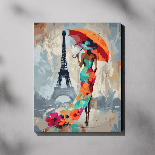 Canvas print of a woman in a colorful dress holding an orange umbrella with the Eiffel Tower in the background.