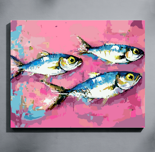 A completed paint by number showing three painted fish on a pink background, displayed against a gray wall.