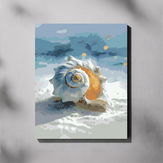 A vertical canvas paint by number featuring a painted seashell on a beach, shown hanging against a light gray wall with soft shadow overlays. The artwork depicts the shell in white, blue, and orange tones against a pale blue and gray seascape.