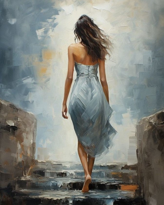 Woman in a strapless dress walking on stone steps with abstract background