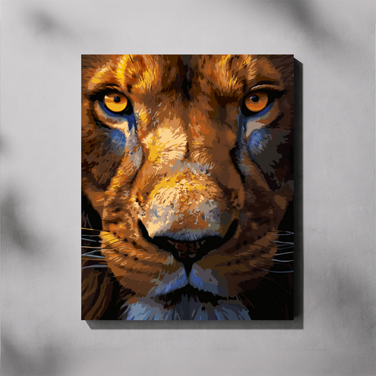 A canvas paint by number wall art featuring a close-up stylized portrait of a lion's face with vivid orange, brown, black, and blue tones, displayed against a light gray wall with soft shadow overlays.