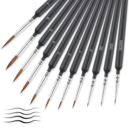 Set of black paintbrushes with varying sizes on a white background