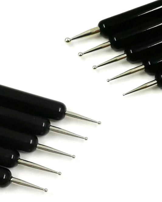 Set of black cylindrical tools with metallic ends on a white background