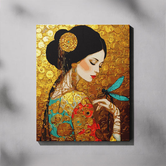 A canvas paint by number featuring an ornate portrait of a woman with black hair, gold jewelry, and a turquoise dragonfly, set against a textured gold background. The canvas is shown hanging on a light gray wall with soft shadow overlays.