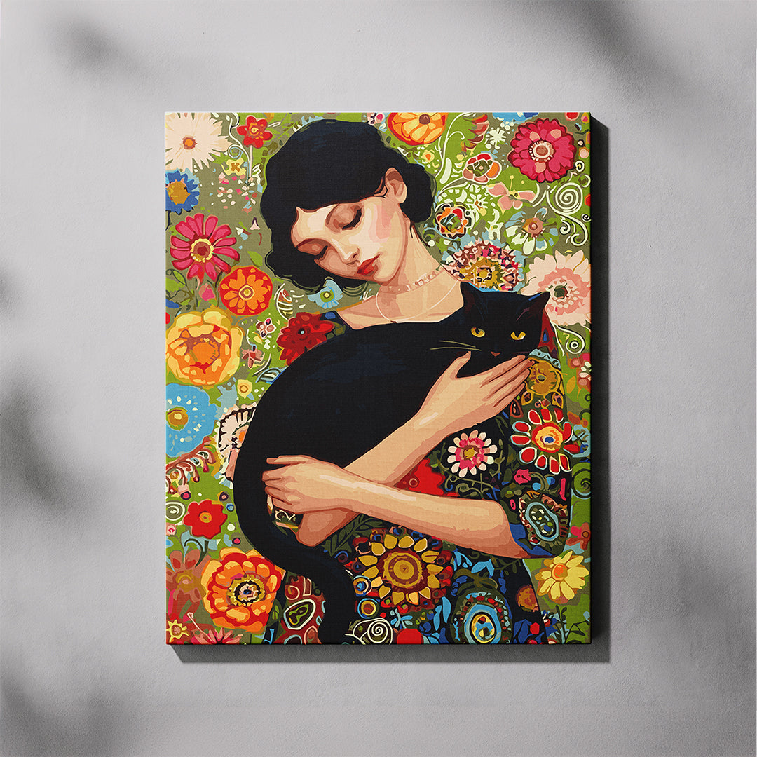 Canvas print of a woman holding a black cat against a floral background