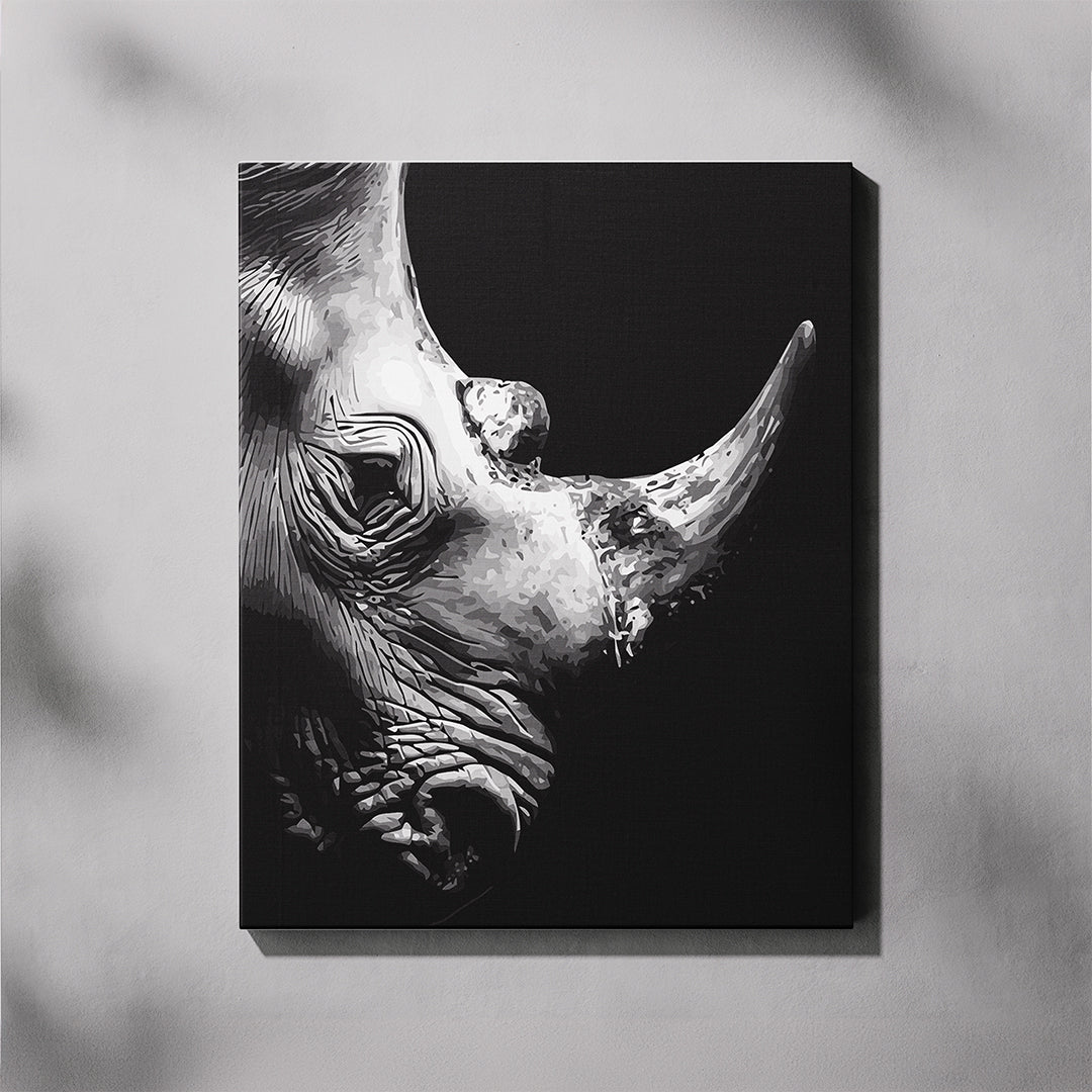 Canvas print of a black and white rhino head on a dark background